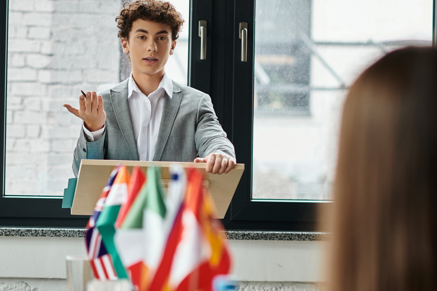 Teenagers participate in a Model UN simulation, debating international issues.